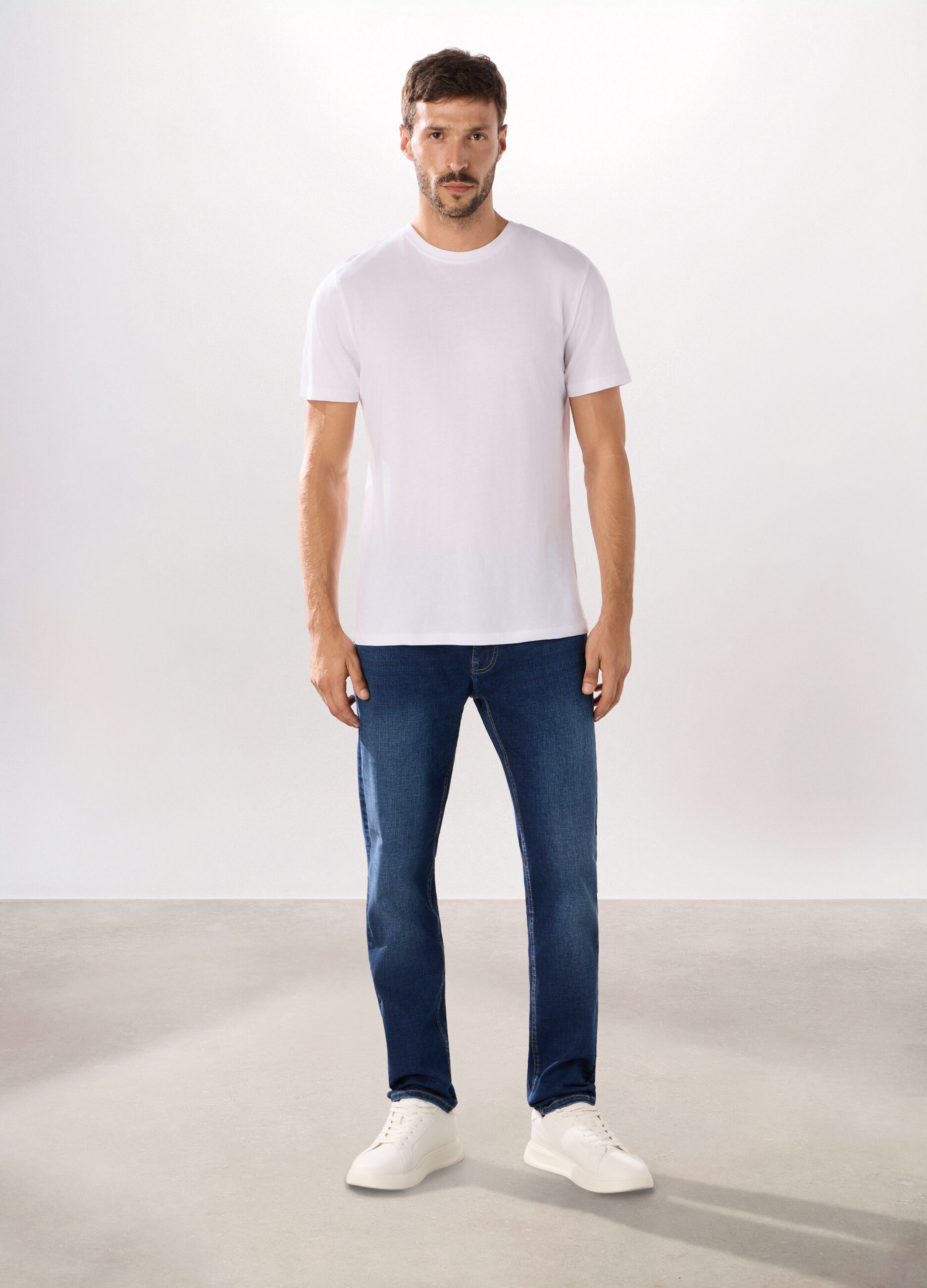 Jeans 5 tasche in denim di cotone stretch uomo