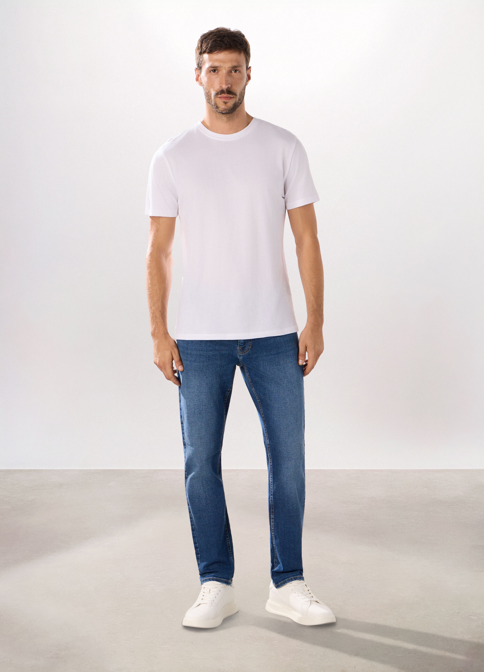 Jeans 5 tasche in denim di cotone stretch uomo